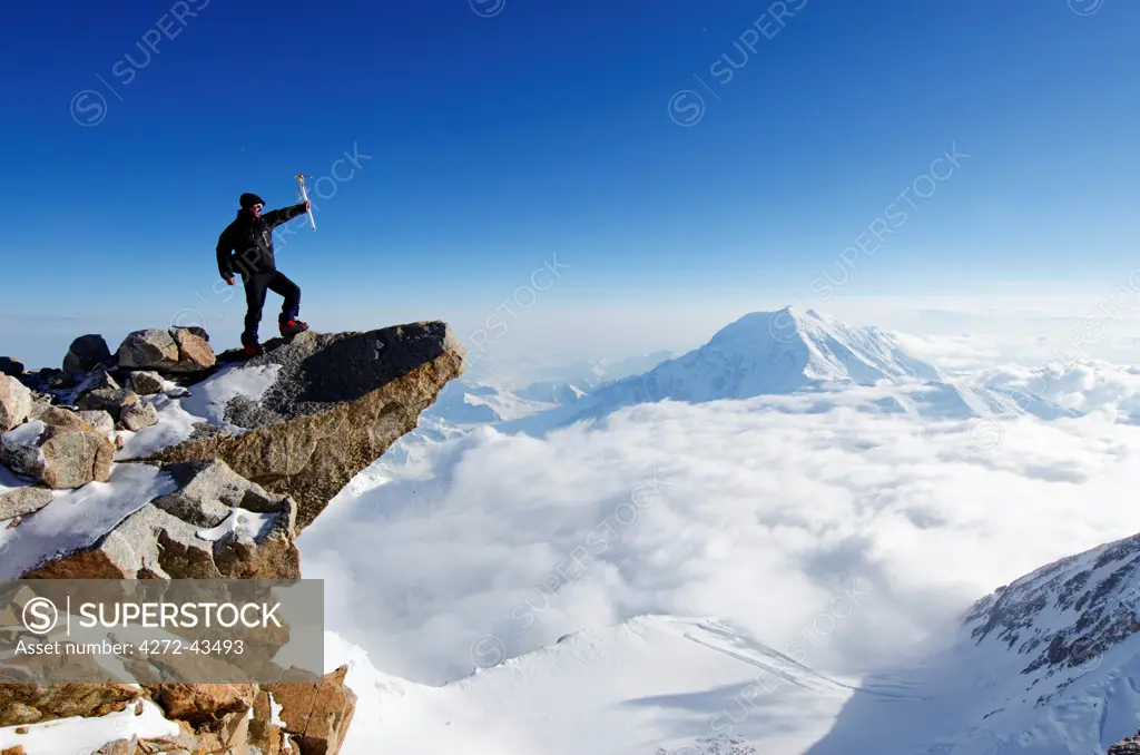 USA, United States of America, Alaska, Denali National Park, Mt Huntington , 4257m, and climber on Mt McKinley 6194m, highest mountain in north America , MR,