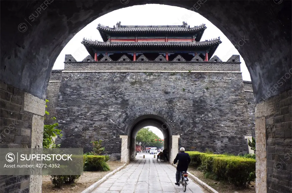 China, Shandong Province, Qufu City. Archway leading to a watch tower on the city Unesco World Heritage Site.