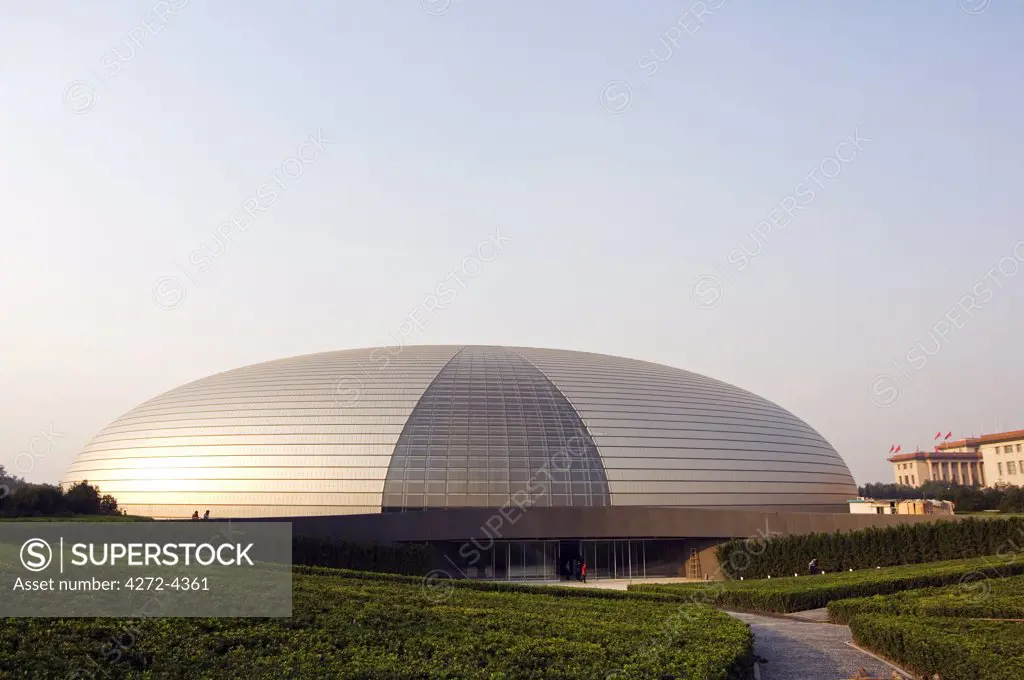 China, Beijing. The soviet style Great Hall of the People contrast with The National Grand Theatre Opera House also known as The Egg designed by French architect Paul Andreu and made with glass and titanium (opened Sept 25th 2007).