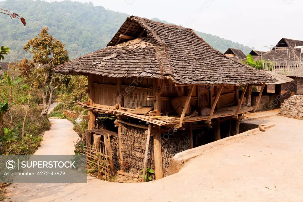 China, Yunnan, Jinghong. A traditional house in a Dai village near Jinghong, with living space on the top, and storage space below.