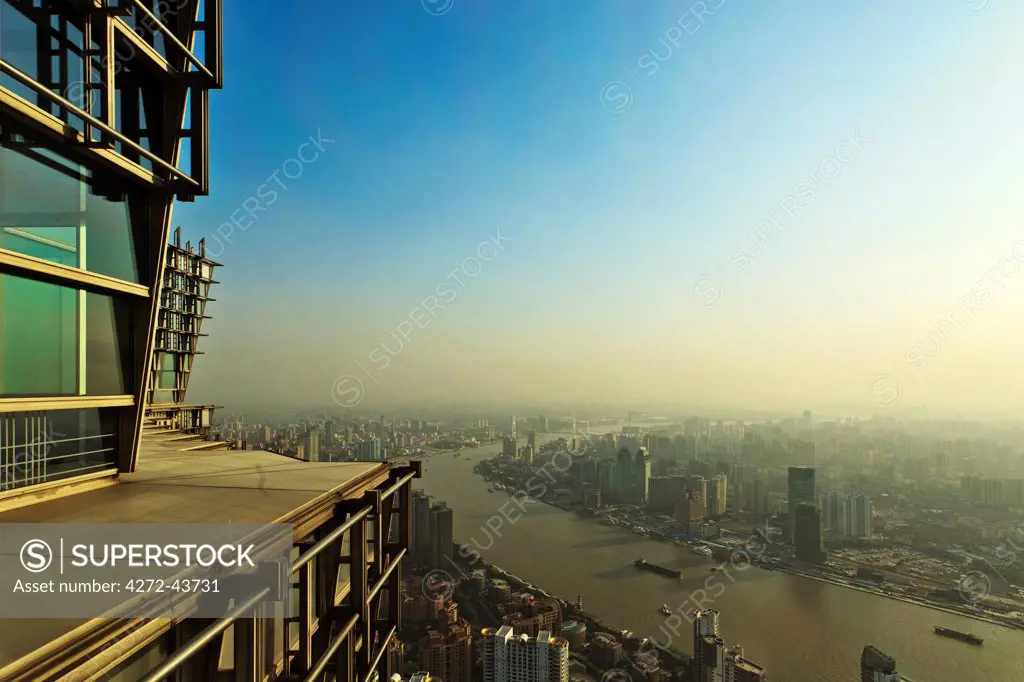 View of downtown Shangahi from above, from the observation level of the Jin Mao Tower designed by the architect Adrian Smith of Skidmore owings and Merrill, SOM,, Pudong, Shanghai, China.