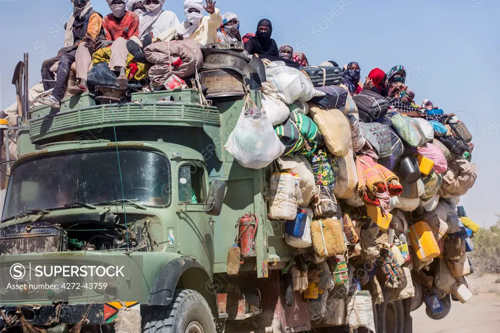 Chad, Kanem, Bahr el Ghazal, Sahel. A grossly over loaded lorry travelling on the rough Bahr el Ghazal route from Faya.