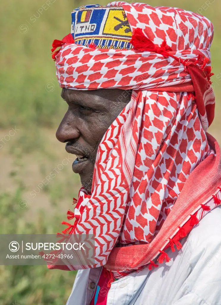 Chad, Arboutchatak, Guera, Sahel. A Peul man wearing a colourful headscarf or cheche.