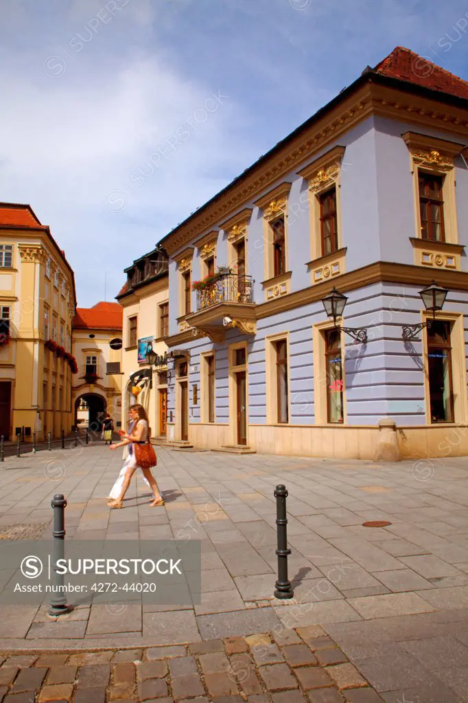 Brno, Moravia, Czech Republic. Two young women walking in the historical centre
