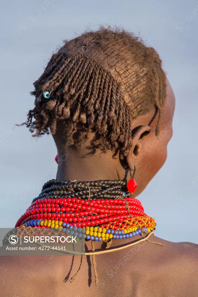 The braided and ochred hair of a Dassanech girl, Ethiopia