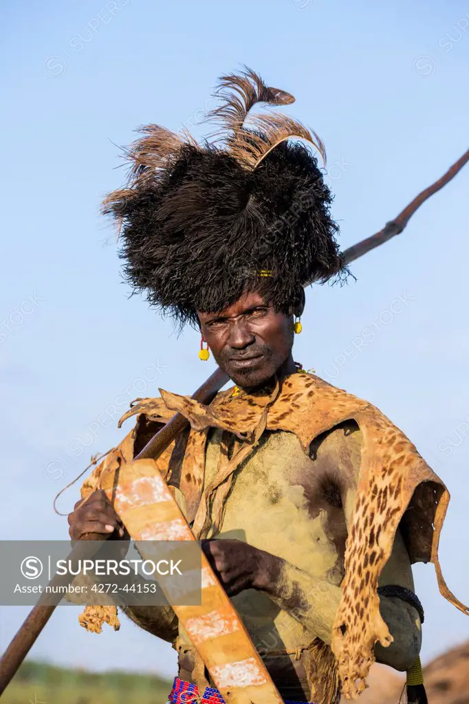 A portrait of a Dassanech man dressed in ceremonial Dimi regalia, Ethiopia