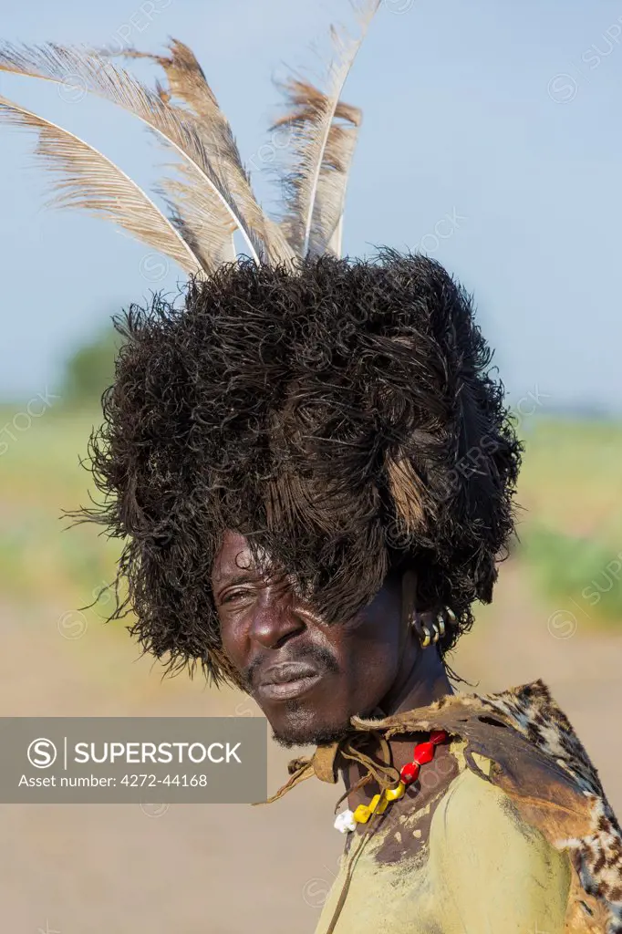 A portrait of a Dassanech man dressed in ceremonial Dimi regalia, Ethiopia
