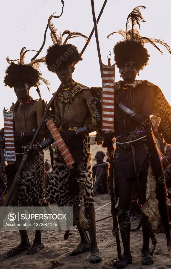 Dassanech men dressed in ceremonial regalia after participating in a Dimi dance, Ethiopia
