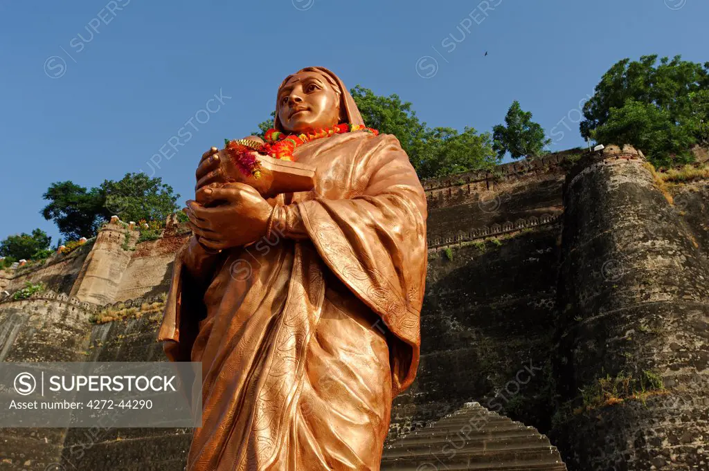 India, Madhya Pradesh, Maheshwar. At the foot of Ahilya Fort beside the Narmada River, a statue comemorates the life of Ahilya Bai Holkar.