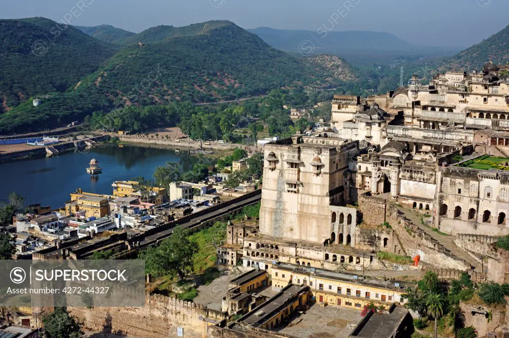 India, Rajasthan, Bundi. Looming over Bundi town and Nawal Sagar, or Nawal Lake, Bundi's royal palace remains one of Rajasthan's most atmospheric and evocative Rajput buildings.