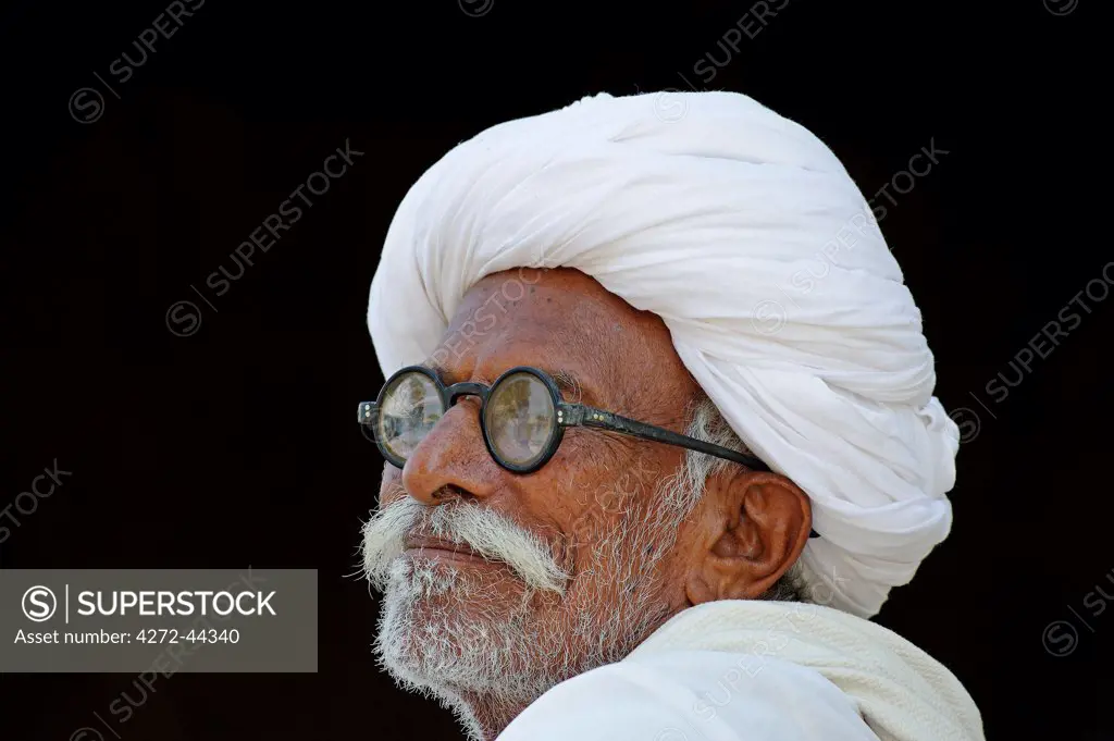 India, Rajasthan, Rohet. A Bishnoi man; the Bishnoi, or Vishnoi, are a distinctive conservation minded Hindu sect founded in the 15th century who adhere to strict tenets. Men commonly wear white robes and turbans.