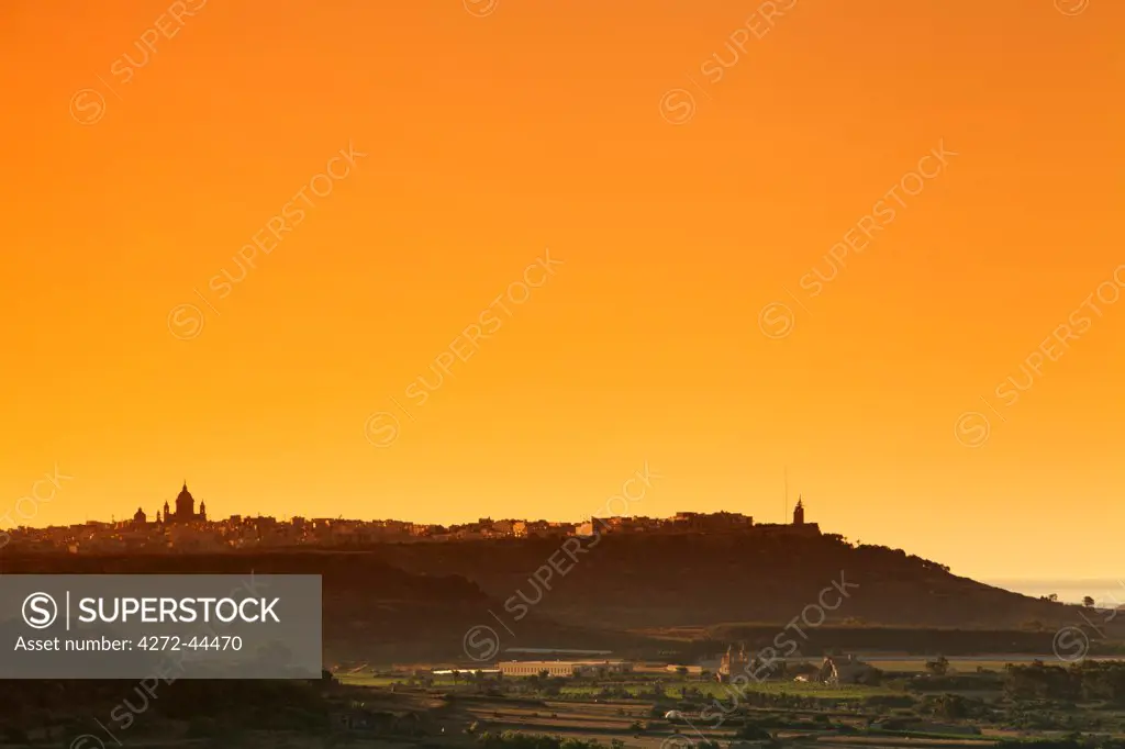 Mediterranean Europe, Maltese Islands, Gozo. Villages on the islands seen in the distance with landscape