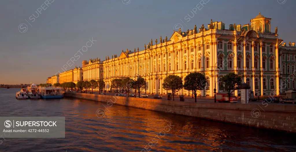 Russia, St.Petersburg. The Hermitage Museum across the Neva River in dramatic lights during the White Nights