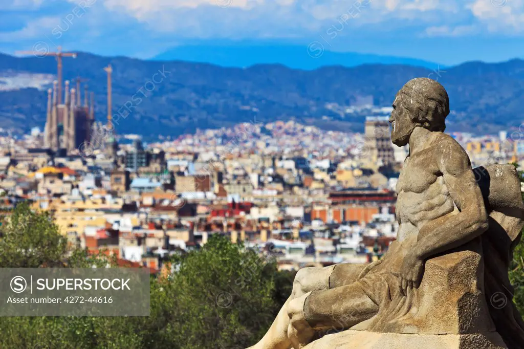 Statue located at the Museu Nacional d'Art de Catalunya overlooking the city of Barcelona, with the Sagrada Familia Cathedral in the background, Sants Montjuic, Barcelona, Cataluna, Spain.