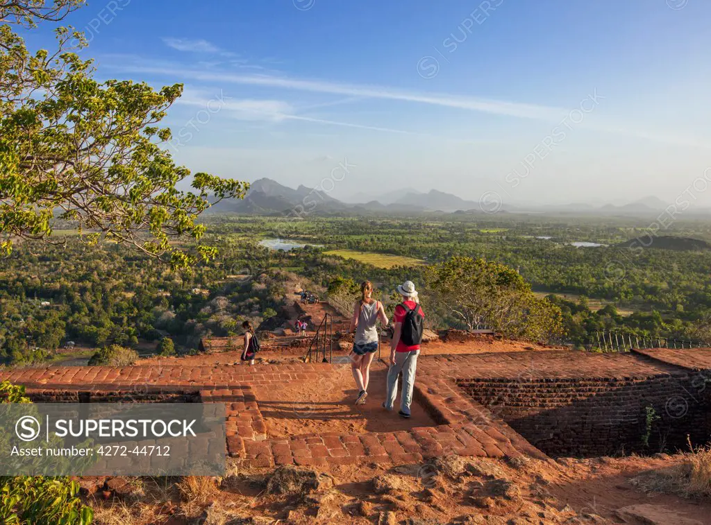 Visitors on the summit of Sigiriya Rock, the site of an ancient monastery, Sigiriya, Sri Lanka