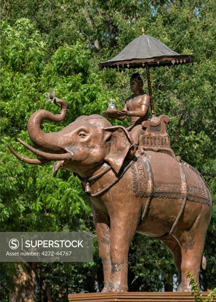 An attractive statue of a temple elephant on a round a bout in Dambulla, Sri Lanka