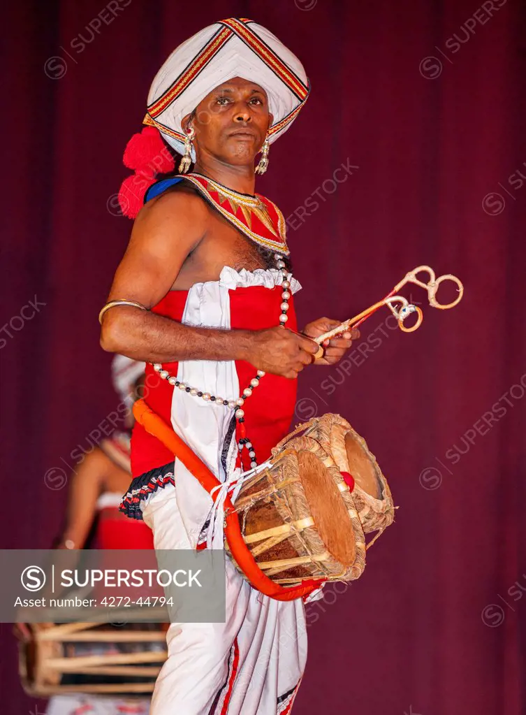 A skilful Kandyan drummer performs during a display of Kandyan and Low Country dances at Kandy, Sri Lanka