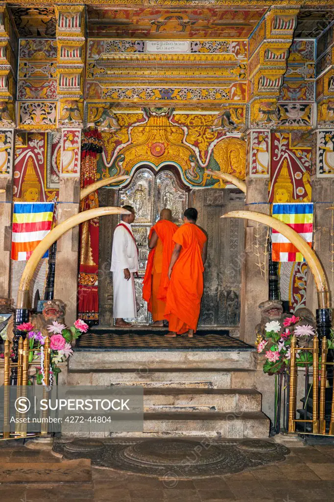 A ritual inside the Temple of the Sacred Tooth Relic is performed three times a day by monks. This temple houses the venerated tooth relic of Lord Buddha, Sri Lanka