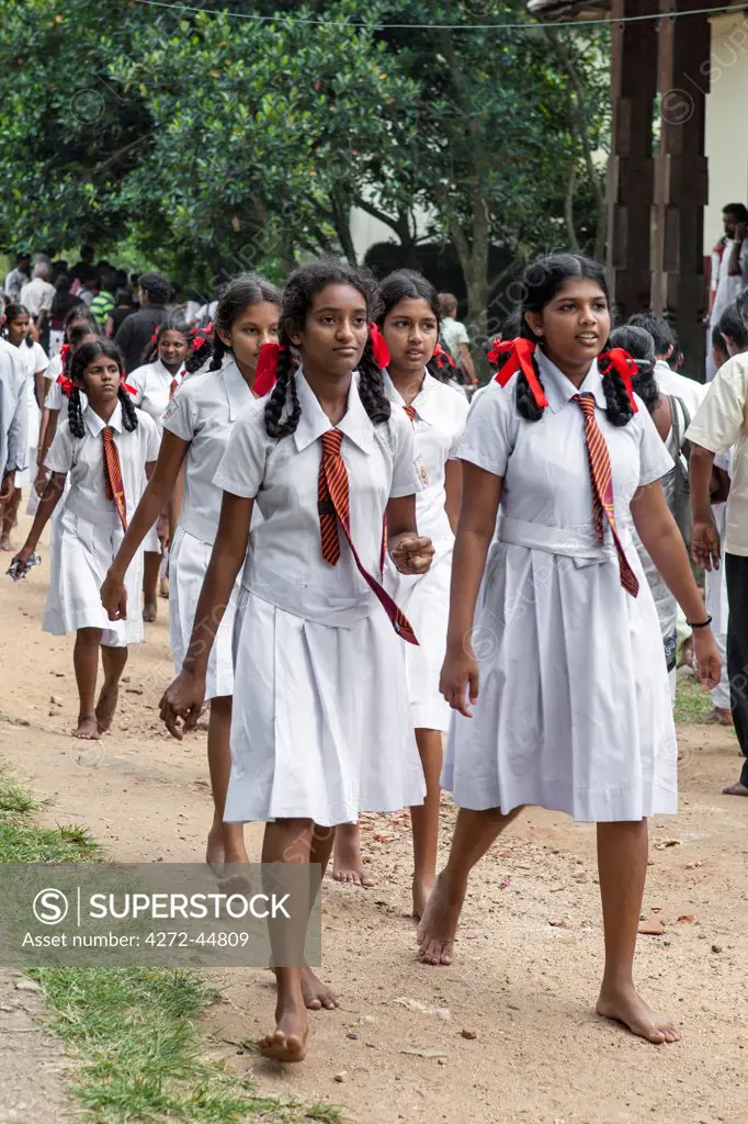 Schoolgirls visit the Sacred Temple of the Tooth Relic. This temple  houses the venerated tooth relic of Lord Buddha, Sri Lanka