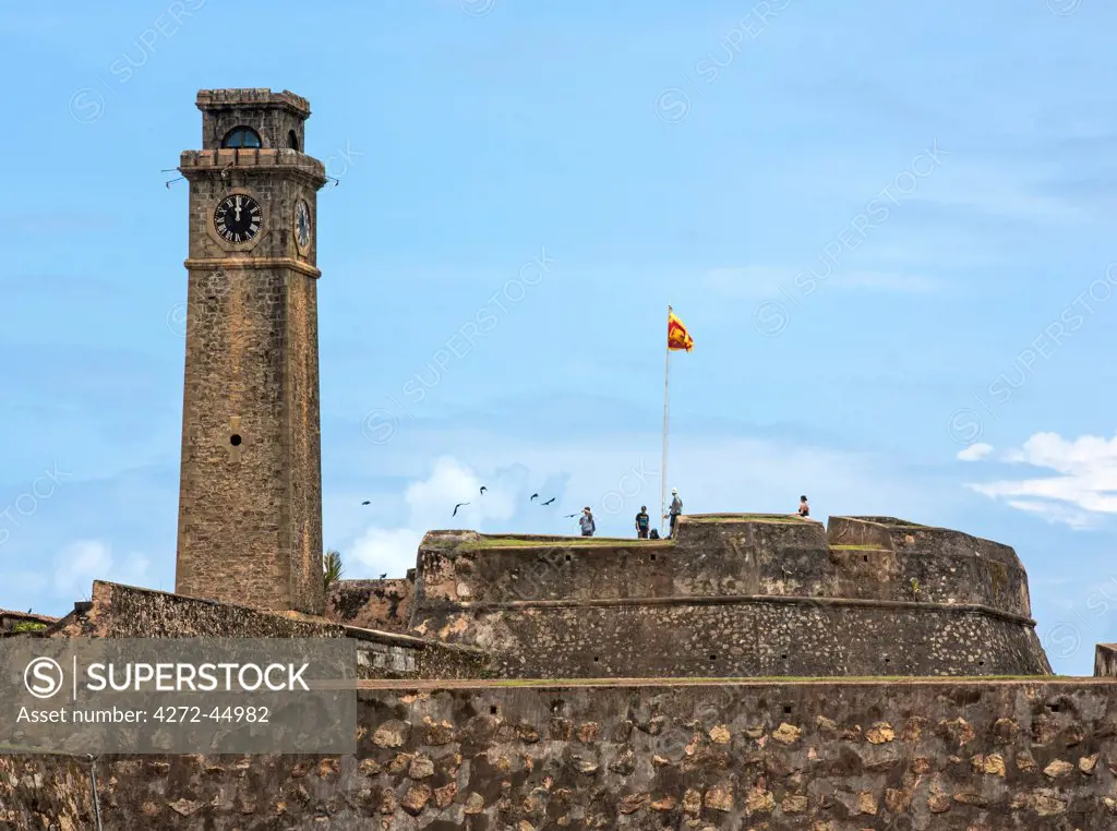 The British built clocktower and 17th century Dutch stone walls of Moon Bastion at Galle Fort, Sri Lanka