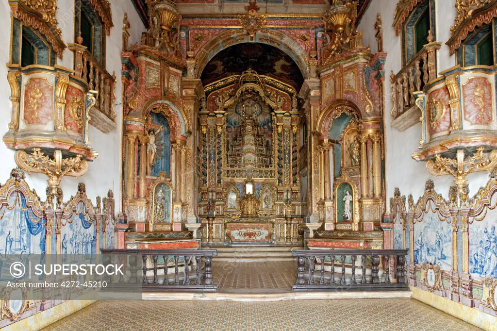 South America, Brazil, Alagoas, Rio Sao Francisco, Penedo, azulejos and rich carvings around the altar piece produced by the Afro Brazilian painter and sculptor Liborio Lazaro Leal in 1784, inside the nave of the Portuguese baroque Church of Our Lady of the Current