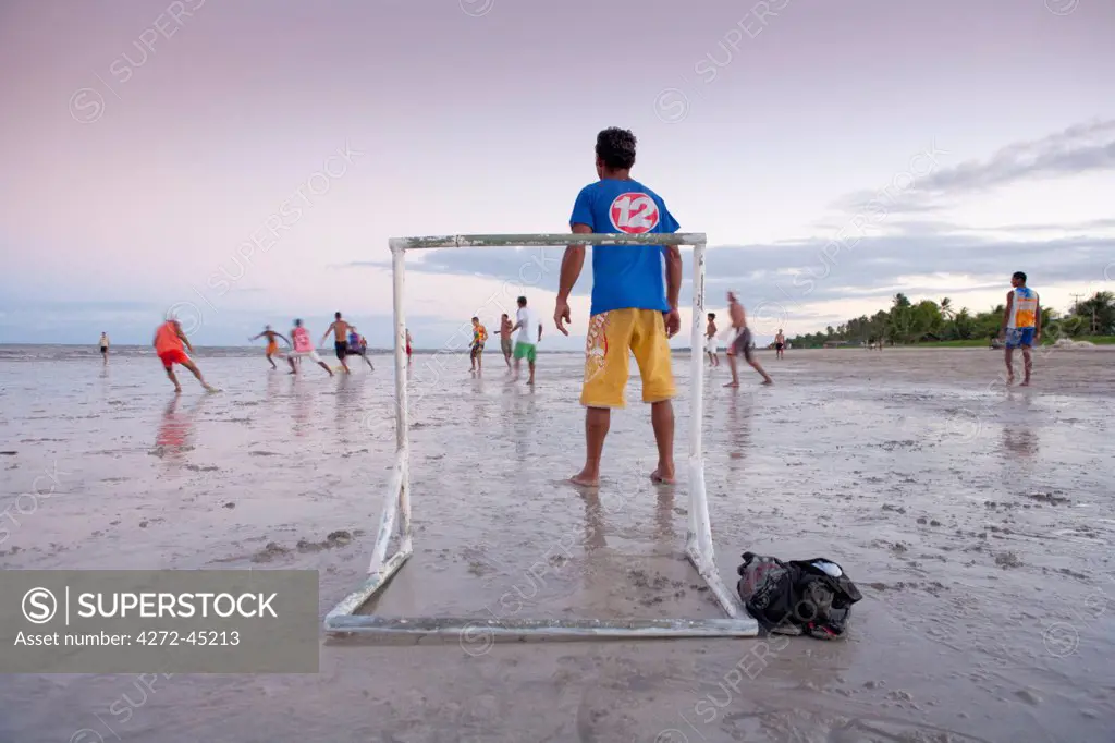 South America, Brazil, Alagoas, Maragogi, locals playing football, soccer, on the beach at low tide