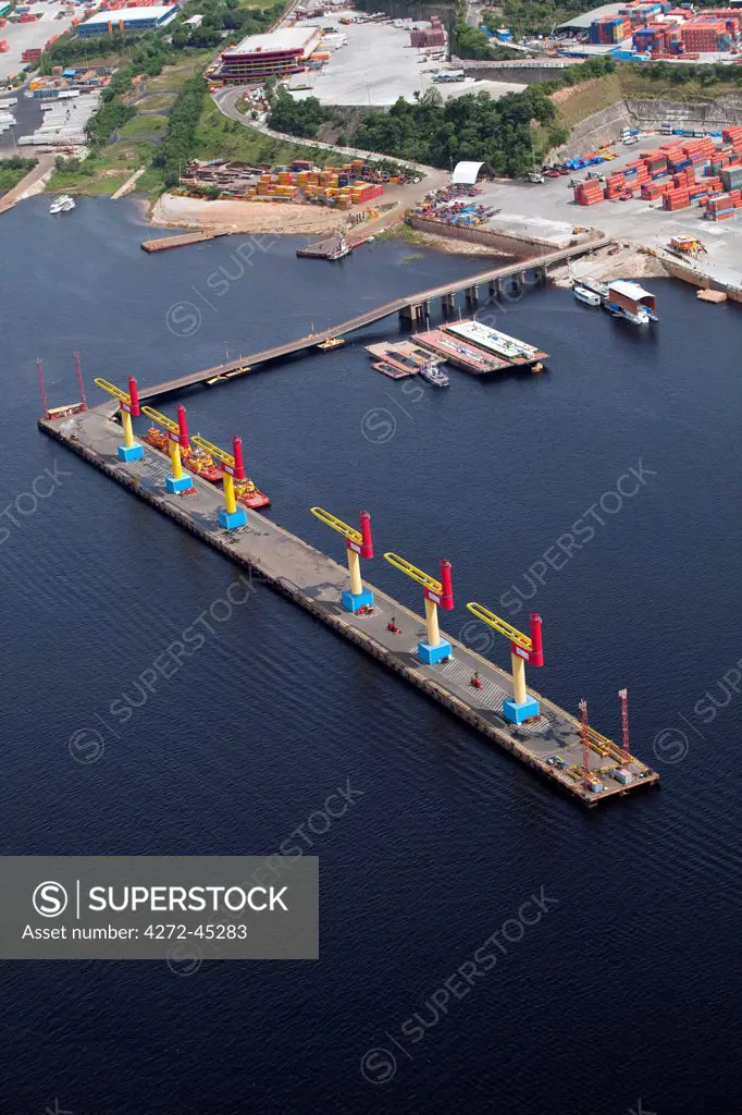 Brazil, Amazonas, cranes on the container ship dock on the Rio Negro in Manaus in the Brazilian Amazon