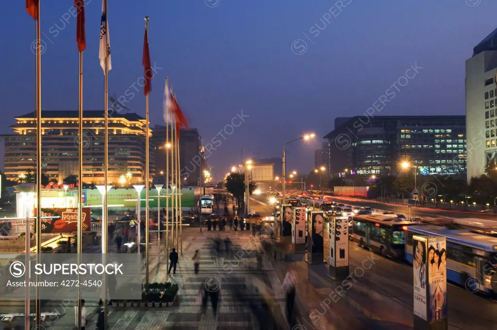 China, Beijing, Xidan Shopping district. Commuters and shoppers on the busy city streets.