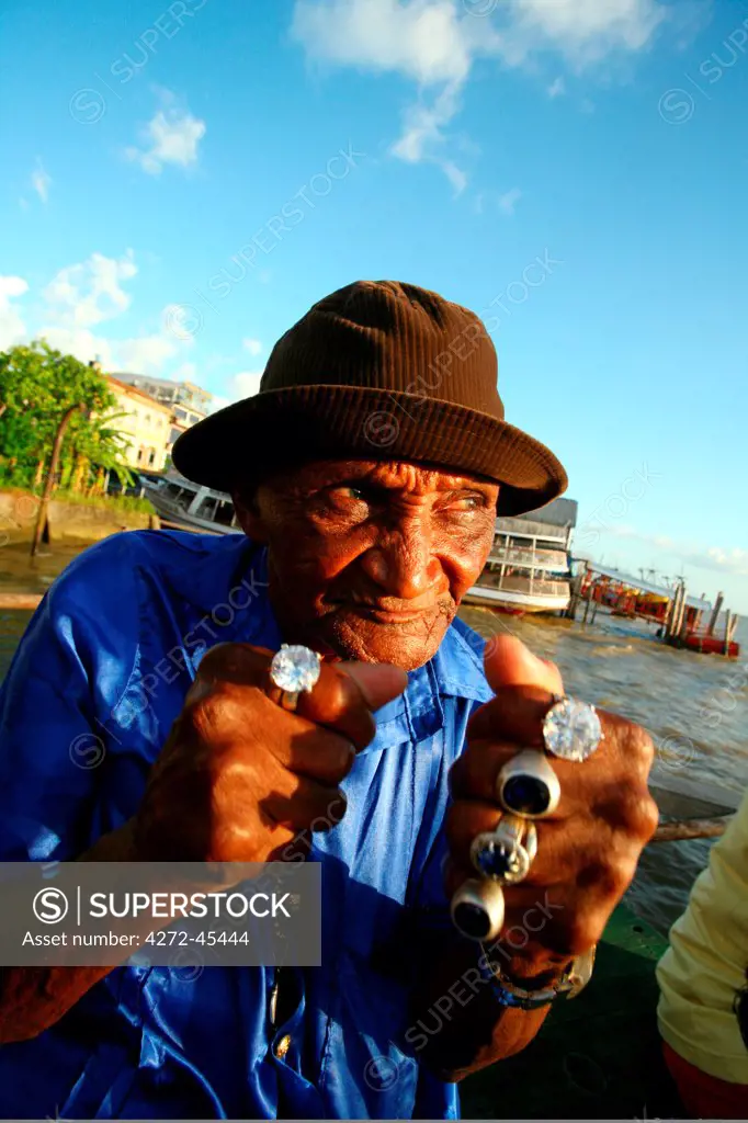 South America, Brazil, Para, Belem, Singer and mouth organ player Mestre Laurentino of the carimbo rock group Coletivo Radio Cipo on the docks in Belem in the Brazilian Amazon