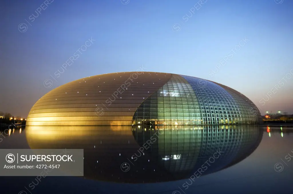 China Beijing An illuminated National Grand Theatre Opera House known as The Egg and designed by French architect Paul Andreu .