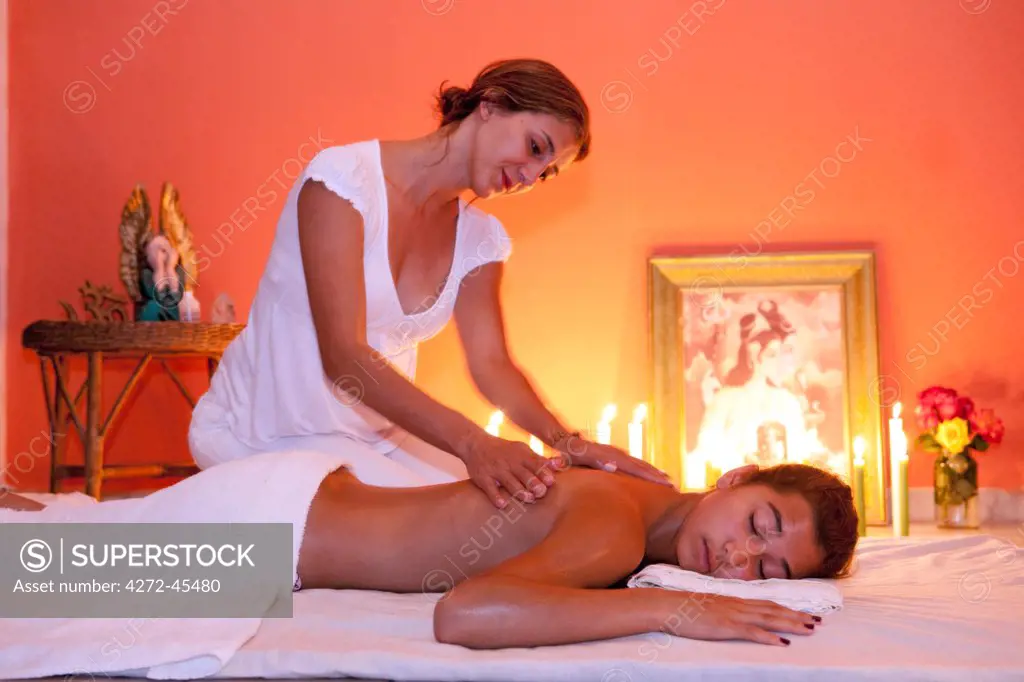 South America, Brazil, Goias, Chapada dos Veadeiros, Alta Paraiso de Goias, Silvia Luz giving massage therapy in her home