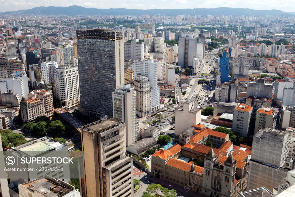 South America, Brazil, Sao Paulo; view of Sao Paulo city from the top of the Banespa Tower, showing Avenida 23 de Maio and the Benedictine Monastery, college and Basilica of St. Benedict designed by German architect Richard Berndl