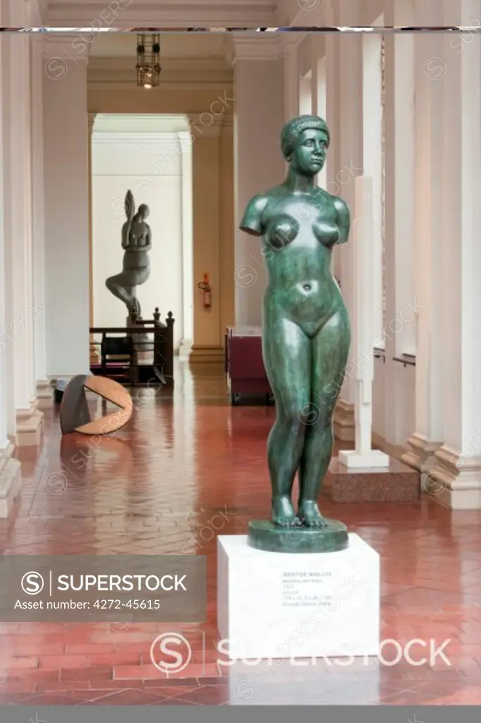 South America, Brazil, Sao Paulo; the interior of the Pinacoteca do Estado art gallery in Luz showing Aristide Maillols Banhista sem braco in the foreground and Carregadora de Perfume by Victor Brecheret behind