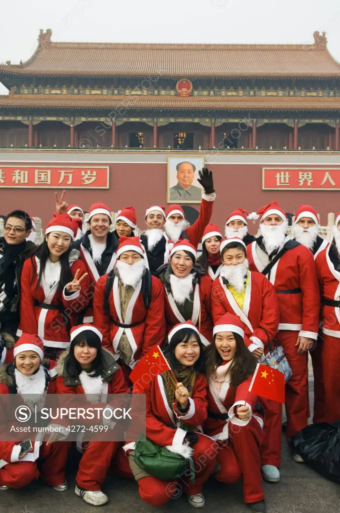 China, Beijing, Tiananmen Square. Foreign and Chinese residents dressed up as Santa on Christmas Day.