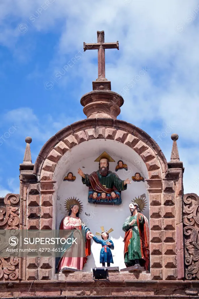 South America, Peru, Cusco. A representation of the holy family   Mary, Joseph and the Christ child with God the father on the roof of the church of Jesus and Mary on the plaza de armas in the UNESCO World Heritage listed former Inca capital of Cusco