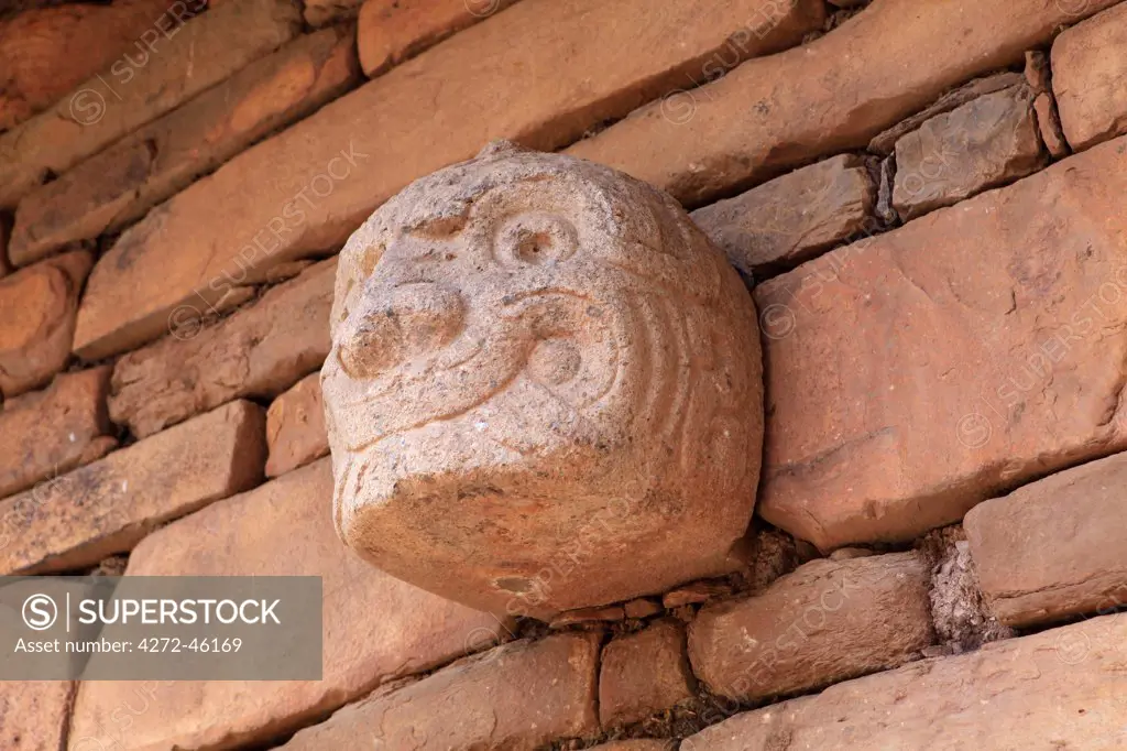 South America, Peru, Ancash, Chavin de Huantar. A Chavin Tenon head on the side of the main building at the Chavin de Huantar archeological site