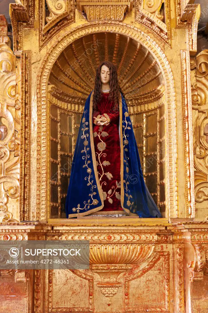 South America, Peru, Cusco, a statue of the Virgin Mary from the Cusquena school, situated in the chapel of San Antonio Abad in the Orient Express Monasterio hotel, which is housed in a former Spanish convent, PR,