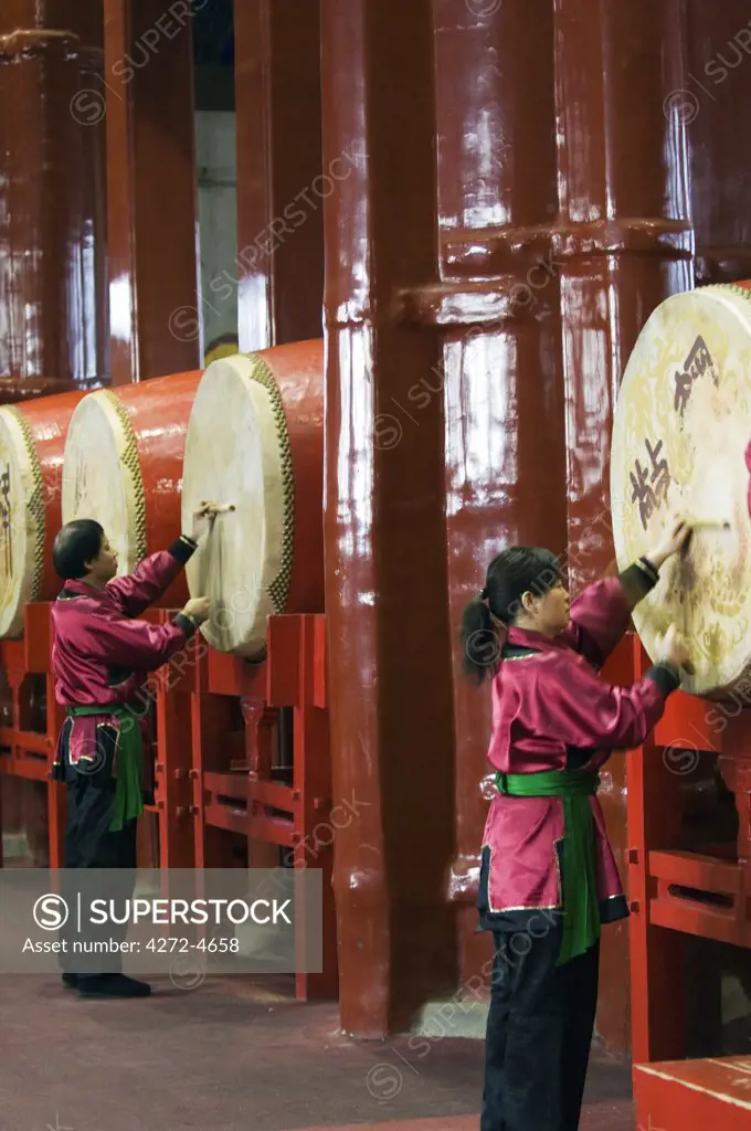 China, Beijing. Drummers inside The Drum Tower, a later Ming dynasty version originally built in 1273 marking the centre of the old Mongol capital, Asia.