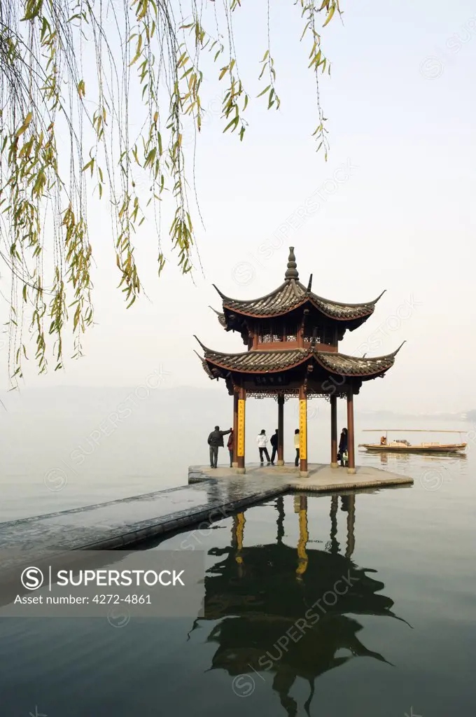 China, Zhejiang Province, Hangzhou. A pavillion early in the morning on West Lake.
