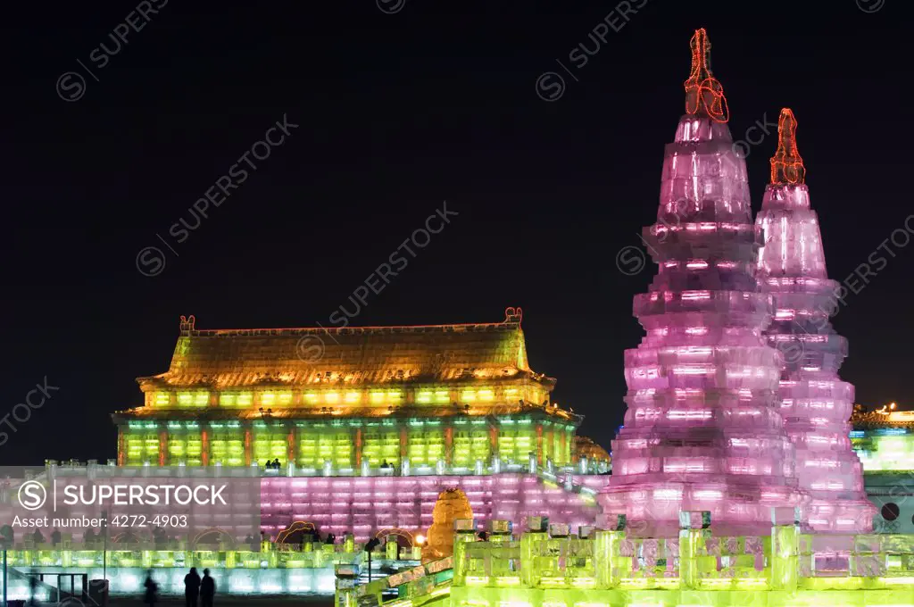 China, Northeast China, Heilongjiang Province, Harbin City. Ice Lantern Festival. A colourful ice sculpture replica of the Forbidden City's Gate of Heavenly Peace in Beijing illuminated at night.