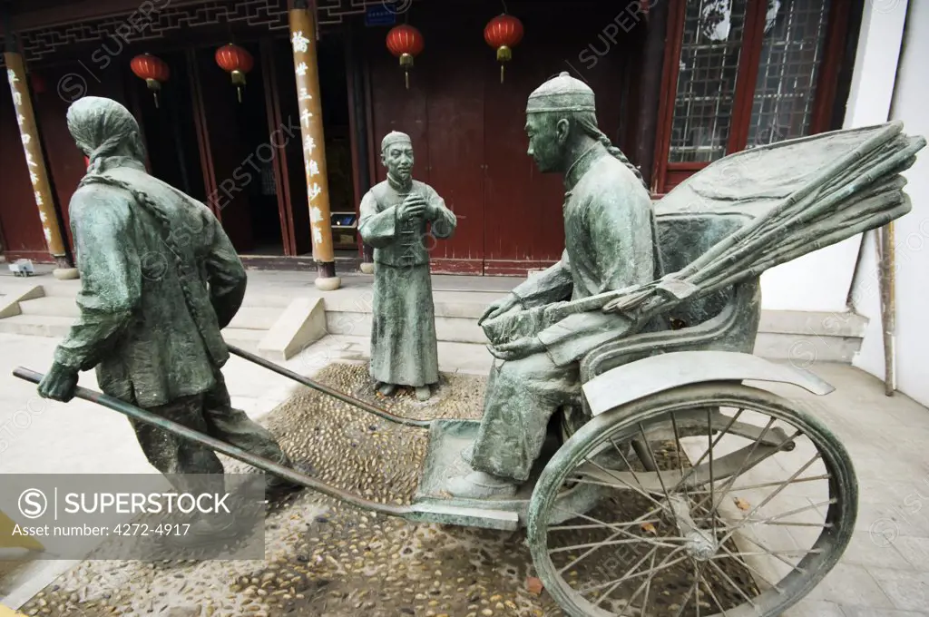 China, Jiangsu Province, Suzhou City. Museum of Opera and Theatre, a bronze statue a rickshaw outside the theatre