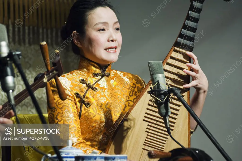 China, Jiangsu Province, Suzhou City. A musician playing the Pipa a tradional Chinese lute instrument