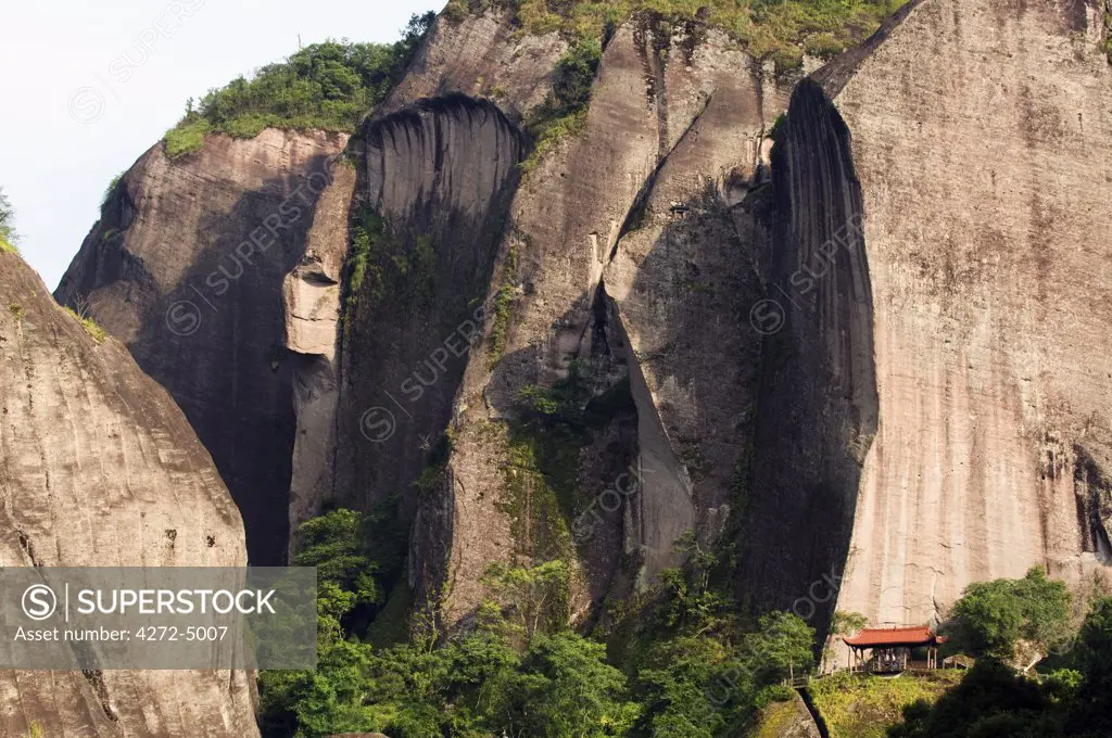 China, Fujian Province, Mt Wuyi National Park, Unesco World Heritage Site, A pavilion below a cliff face