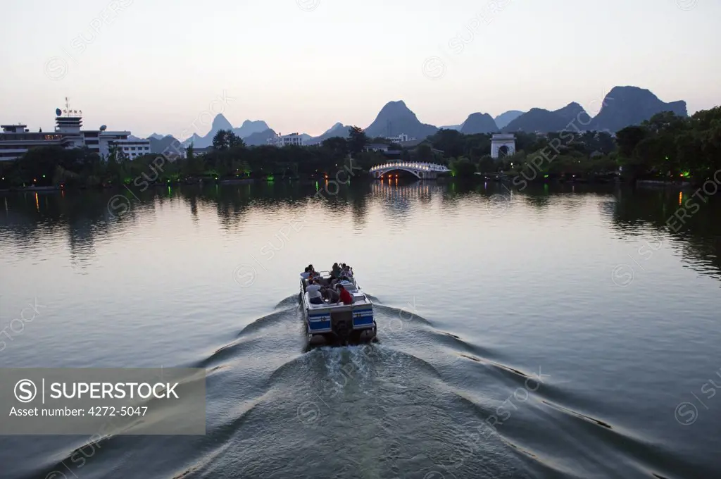 China, Guangxi Province, Guilin. A Boat on Banyan Lake