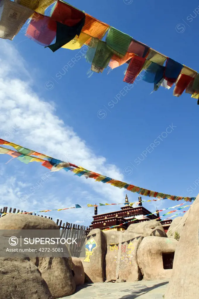 China, Beijing, Ethnic Minorities Park. Tibetan style temple and prayer flags