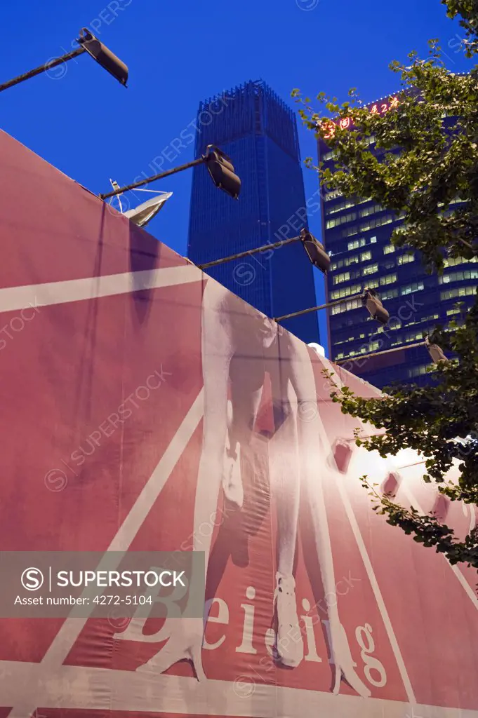China, Beijing, World Trade Phase Three buidling and poster of a sprinter