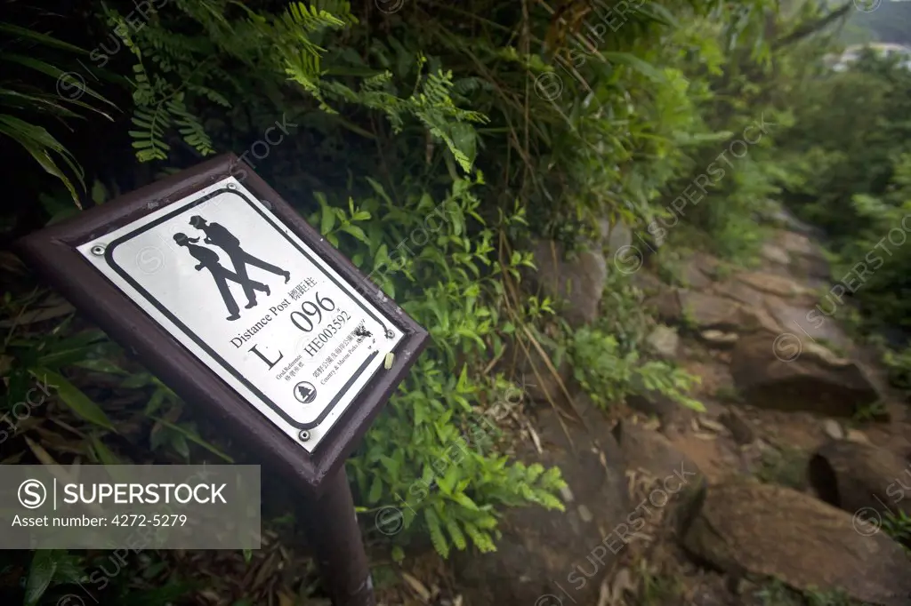 China, Hong Kong, Lantau Island.  Walking and trekking on the Lantau Trail, the footpaths are very well made and well waymarked, marked in places with individual GPS reference points for safety.