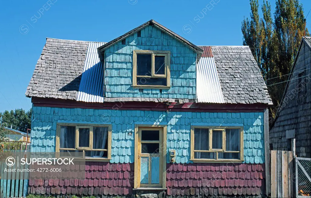 Painted shingle covered house