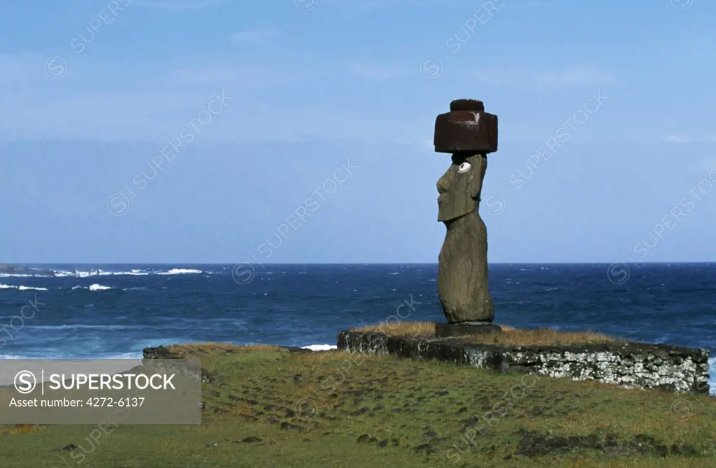 At Ahu Kote Riku, a single well preserved moai with white eyes and a red topknot, sits on top of one of the three ahus or platforms of the ceremonial centre of Tahai.  Tahai is just a short walk from Easter Island's main settlement, Hanga Roa on the west coast of the island, backed by the Pacific Ocean