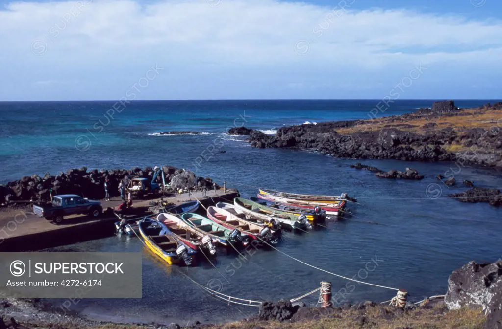 Fishermen's wooden boats moored in a small harbour in La Perouse Bay on the northern coast of the island